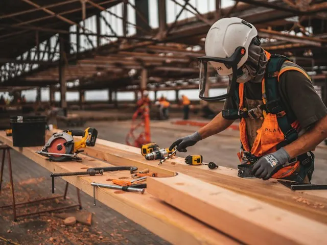 a contractor cutting lumber on a job site